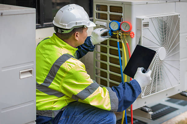 Professional Air Duct Cleaning technician working in Williamsburg, IA